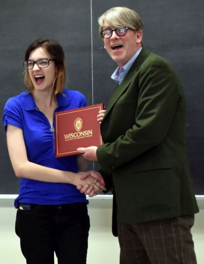 Mathea gets her diploma from Dr. Raimy
