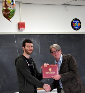 Linguistics student receiving diploma