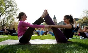 Students doing yoga making 'W' shape