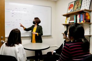 Professor Jacee Cho and students in a lab meeting