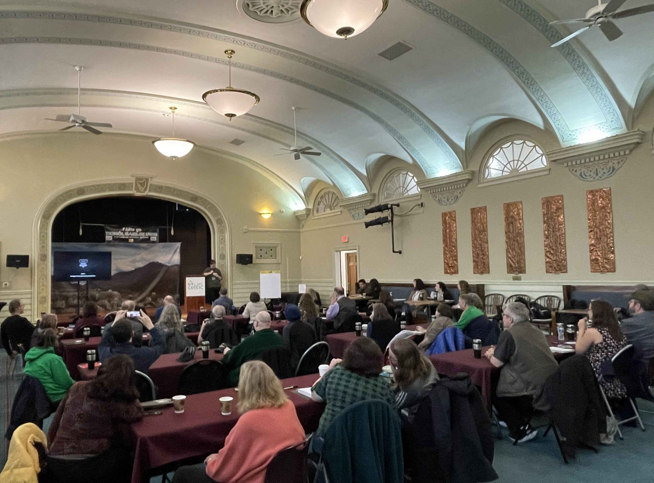 Tessa Culleton, Program Director at the Celtic Studies Center, welcoming participants to the Tionól