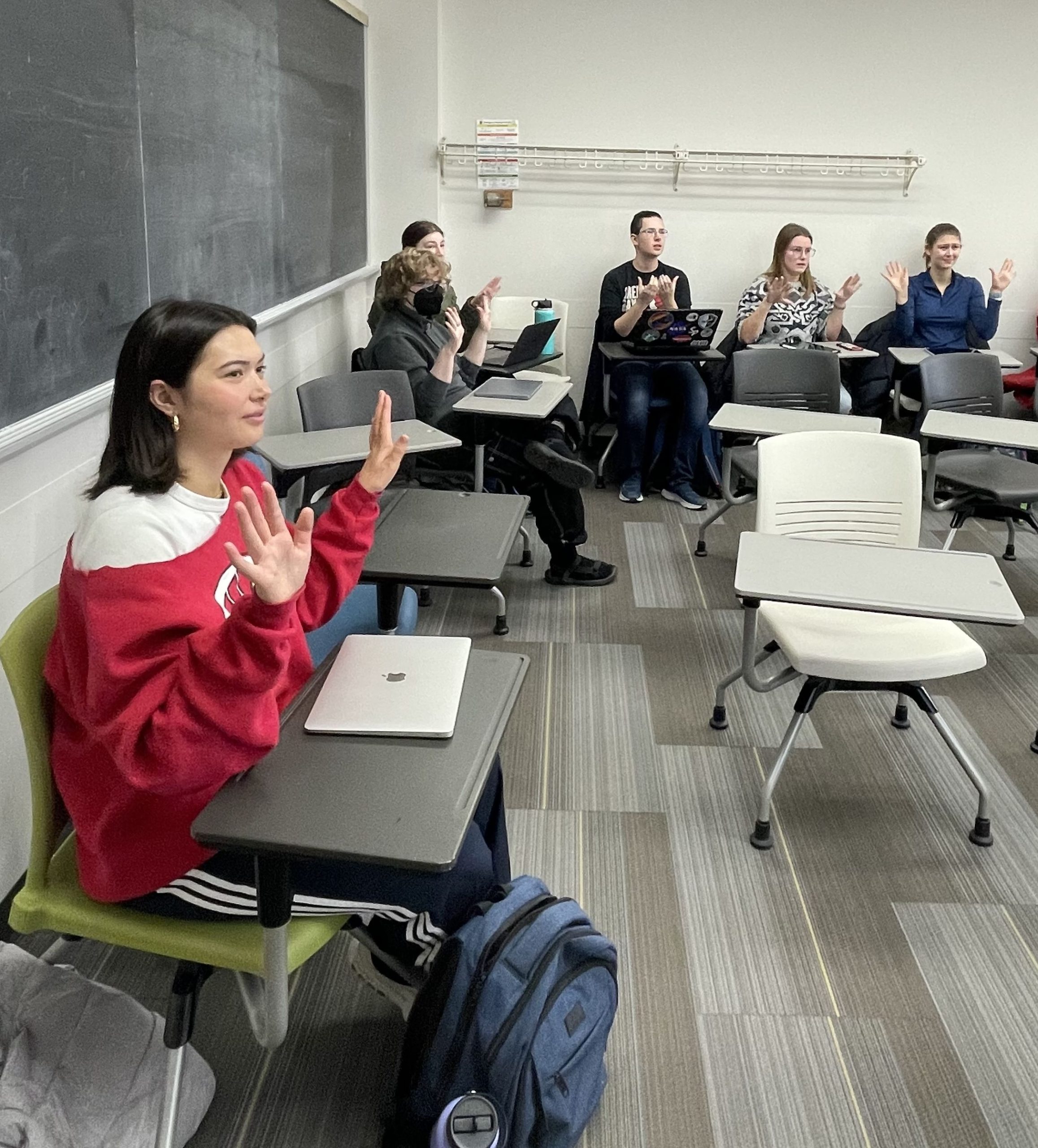 Students learning new signs in ASL class