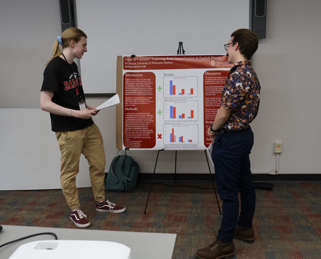 Undergraduate Linguistics major B Cadigan presenting research at the WiGL 18 poster session.
