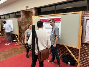 Grad students Annear and Hietpas at the poster session