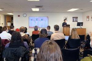 Presenter and audience members at WiGL 20